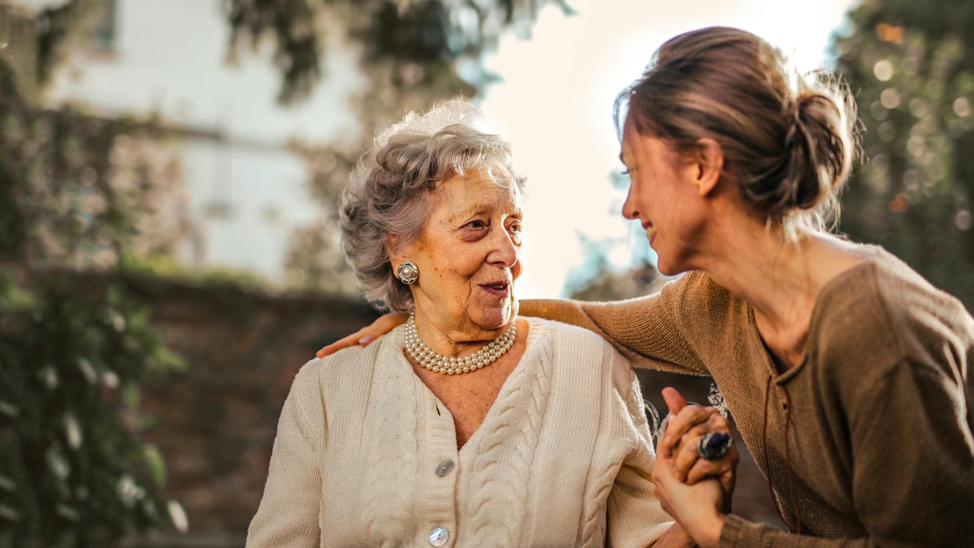 Care worker supporting a resident in a nursing home